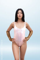 Sea Dragon Studio holographic retro bodysuit back view in silver - high-cut festival rave bodysuit by Sea Dragon Studio.