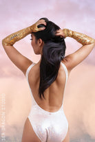 Sea Dragon Studio holographic high-cut retro bodysuit worn at festival - womens rave bodysuit for Burning Man and Pride.