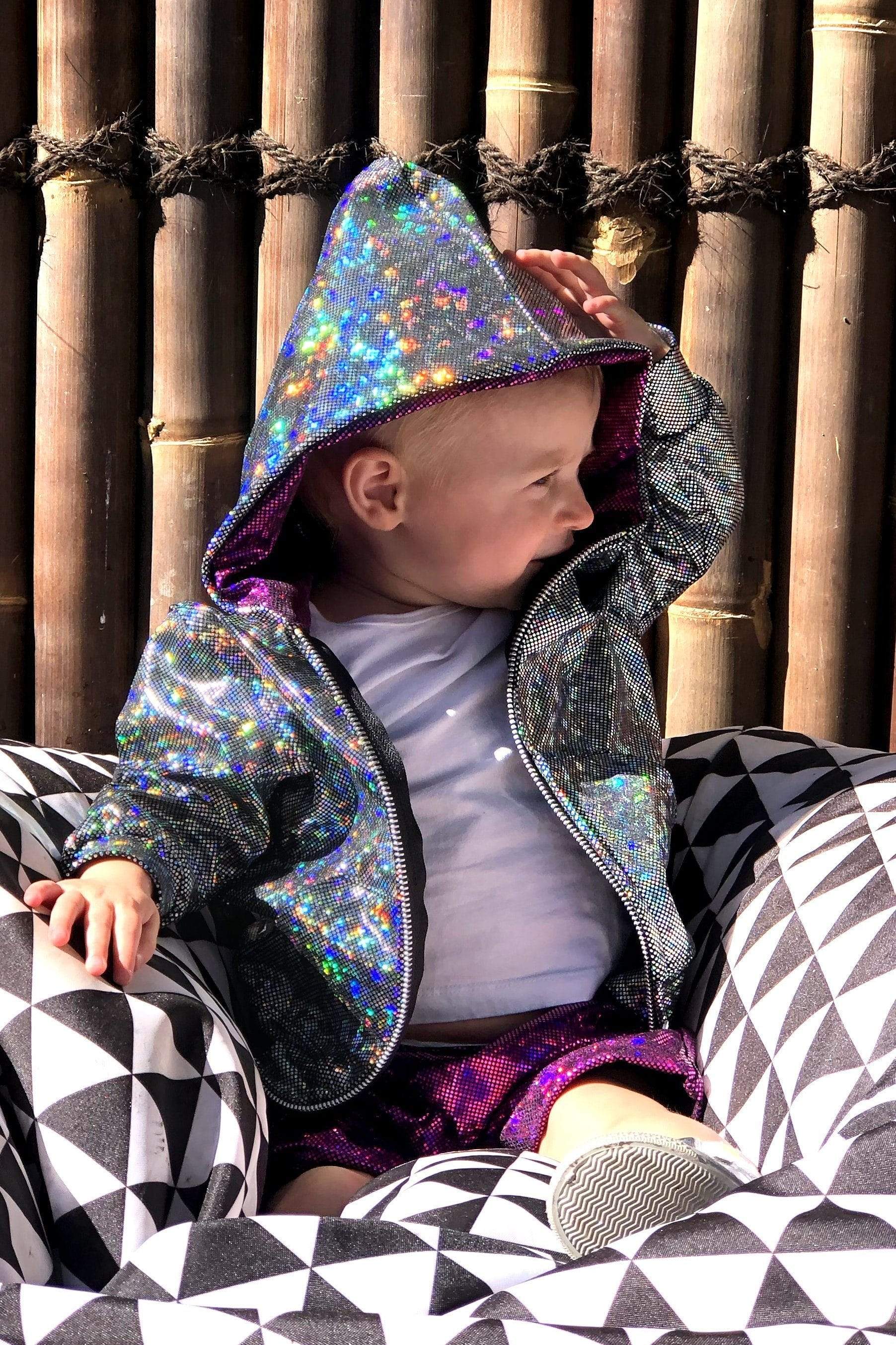 Sea Dragon Studio holographic gender-neutral kids festival jacket — festival and rave wear, worn at festival.