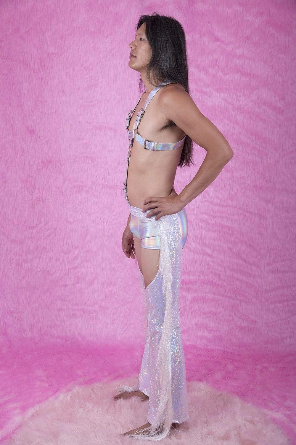 Sea Dragon Studio holographic chaps fringe detail close-up - iridescent festival fabric that catches light at every angle.