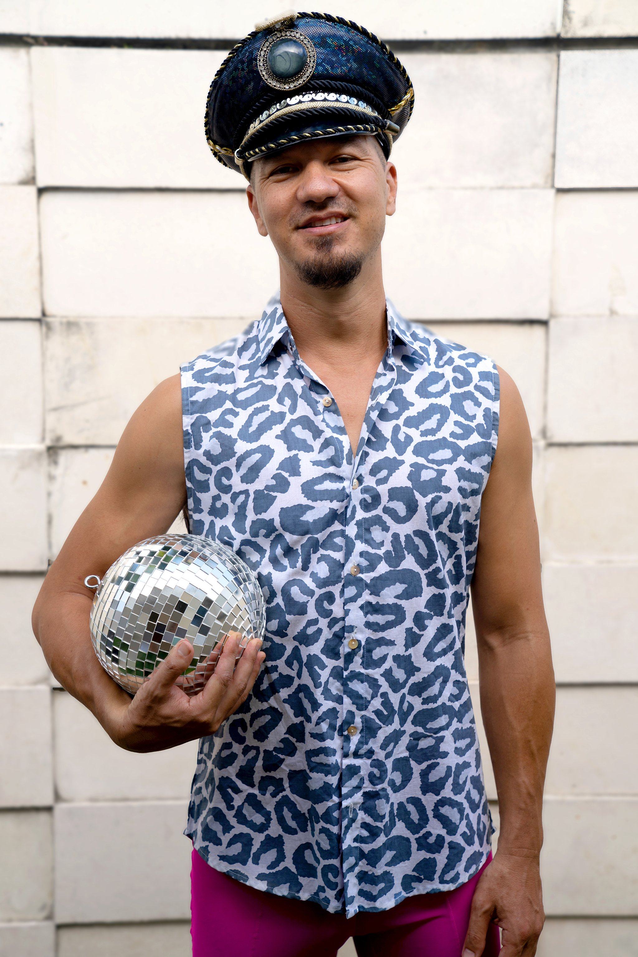 Sea Dragon Studio Dusty Leopard Sleeveless Button Down Shirt mens festival shirt — Burning Man and rave wear, worn at festival.